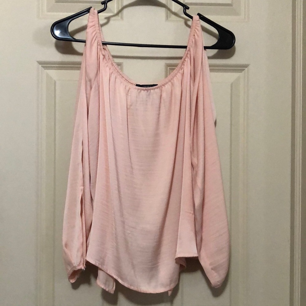 Light pink. Sleeves have slits in them like the back. Off the shoulder.